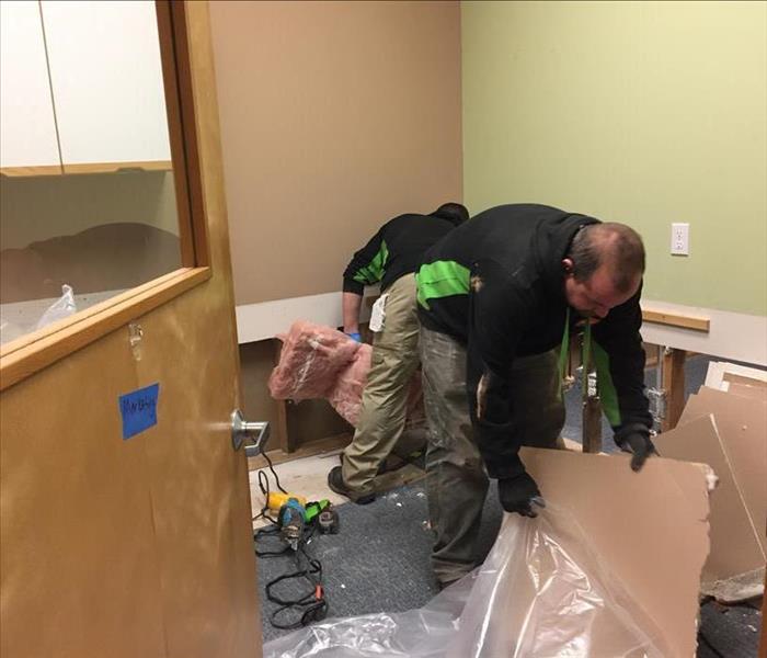 SERVPRO technicians removing drywall