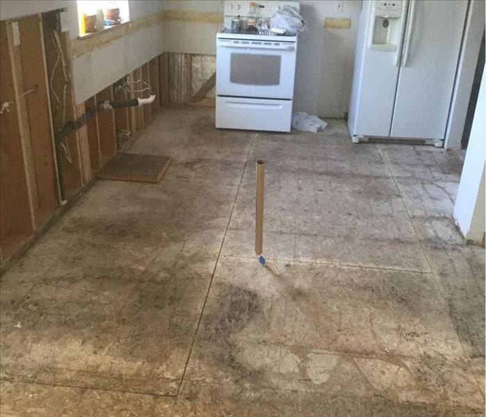 Water damage on the floor from flooding